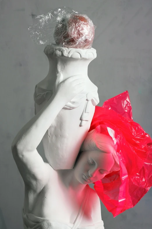 a statue of a man holding a red bag, a marble sculpture, inspired by Jeff Koons, new sculpture, crown of (pink lasers), headpiece headpiece headpiece, experimental studio light, white vase