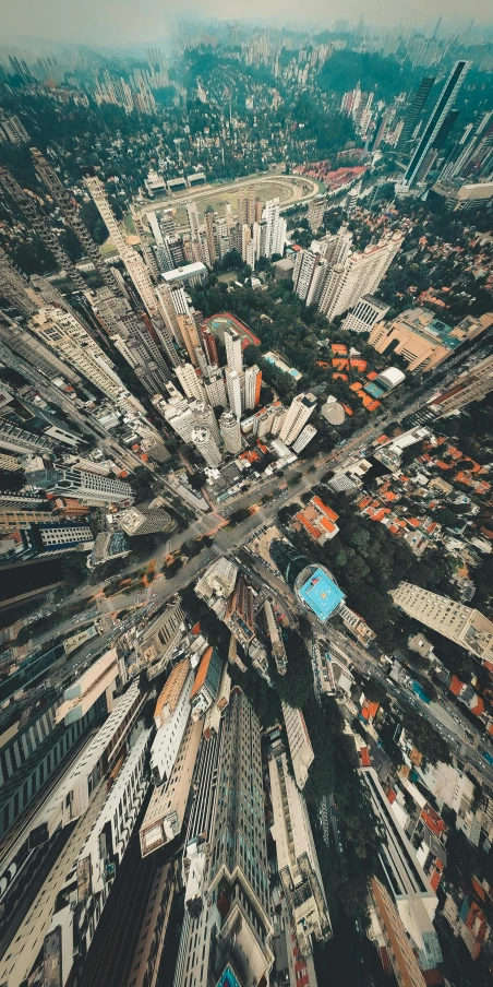 an aerial view of a city with lots of tall buildings, an album cover, by Patrick Ching, pexels contest winner, square, high quality picture, intersection, set on singaporean aesthetic
