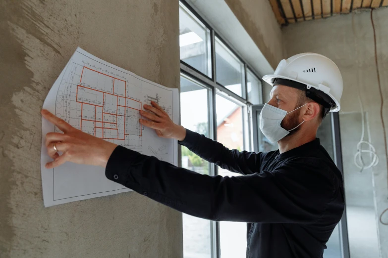 a man in a hard hat pointing at a blueprint, a drawing, pexels contest winner, masked person in corner, profile image, thumbnail, 15081959 21121991 01012000 4k