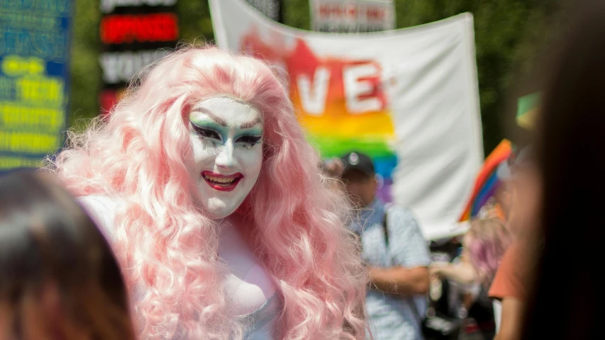 a close up of a person with pink hair and makeup, a photo, pride parade, extremely pale, in costume, high res