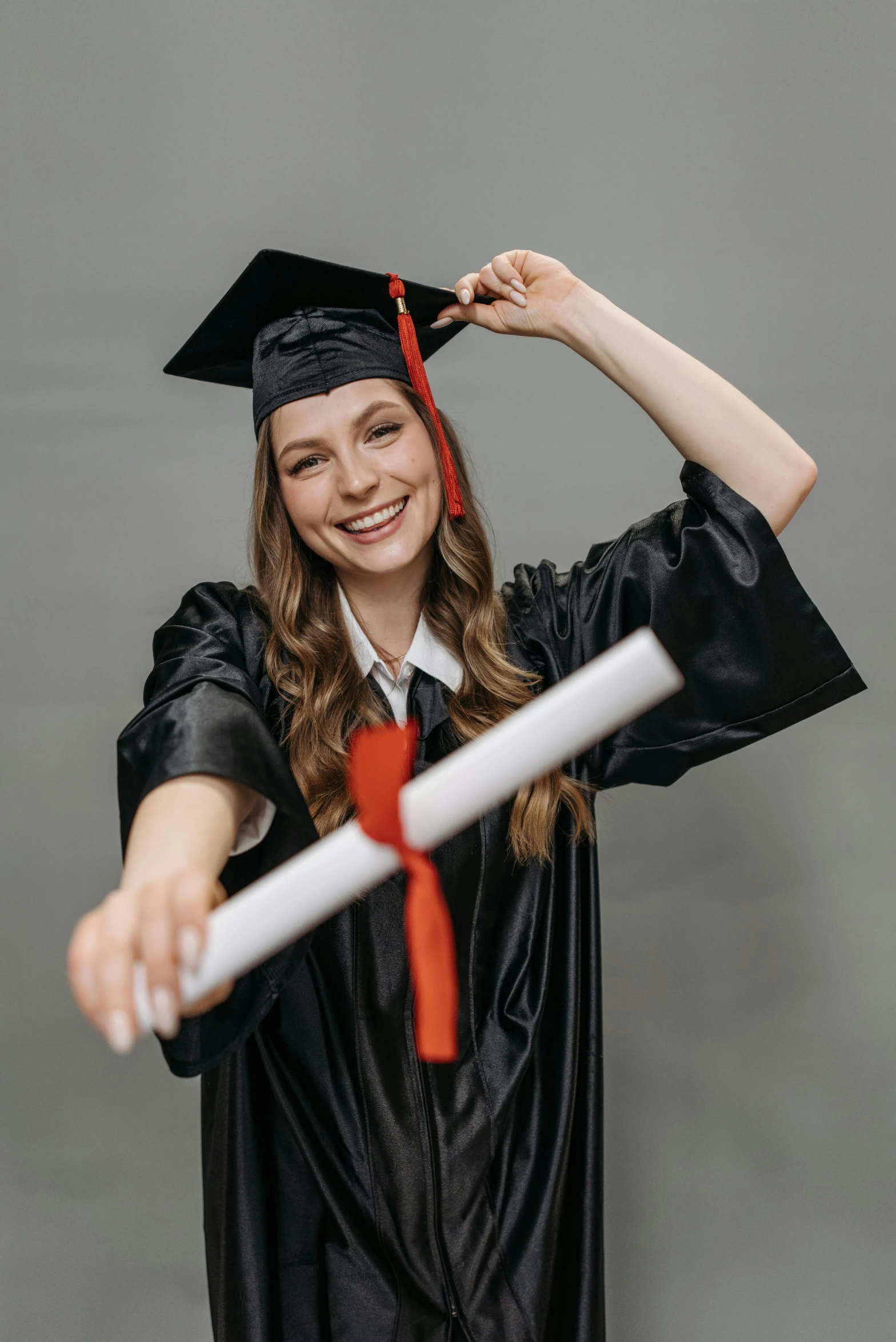 a woman in a graduation gown holding a diploma, a picture, shutterstock, having a good time, leather robes, promo photo, 15081959 21121991 01012000 4k