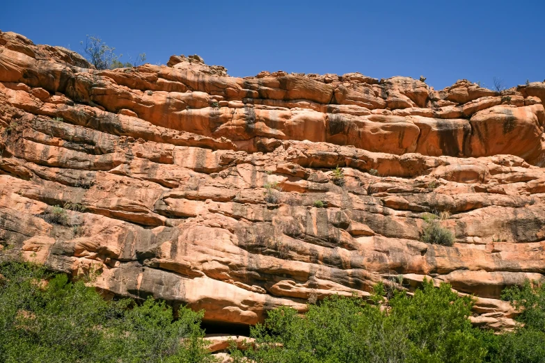 a rocky cliff face with trees in the foreground, unsplash, les nabis, hillside desert pavilion, manuka, slide show, panels