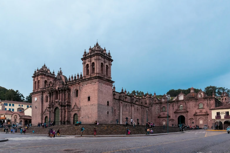 a large pink building sitting on the side of a road, inspired by Steve McCurry, pexels contest winner, ancient catedral behind her, quechua, panorama, square