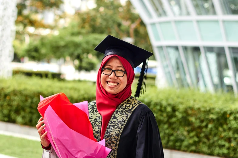 a woman in a graduation gown holding a bouquet, inspired by Ni Yuanlu, academic art, malaysian, multicoloured, candid photograph, islamic