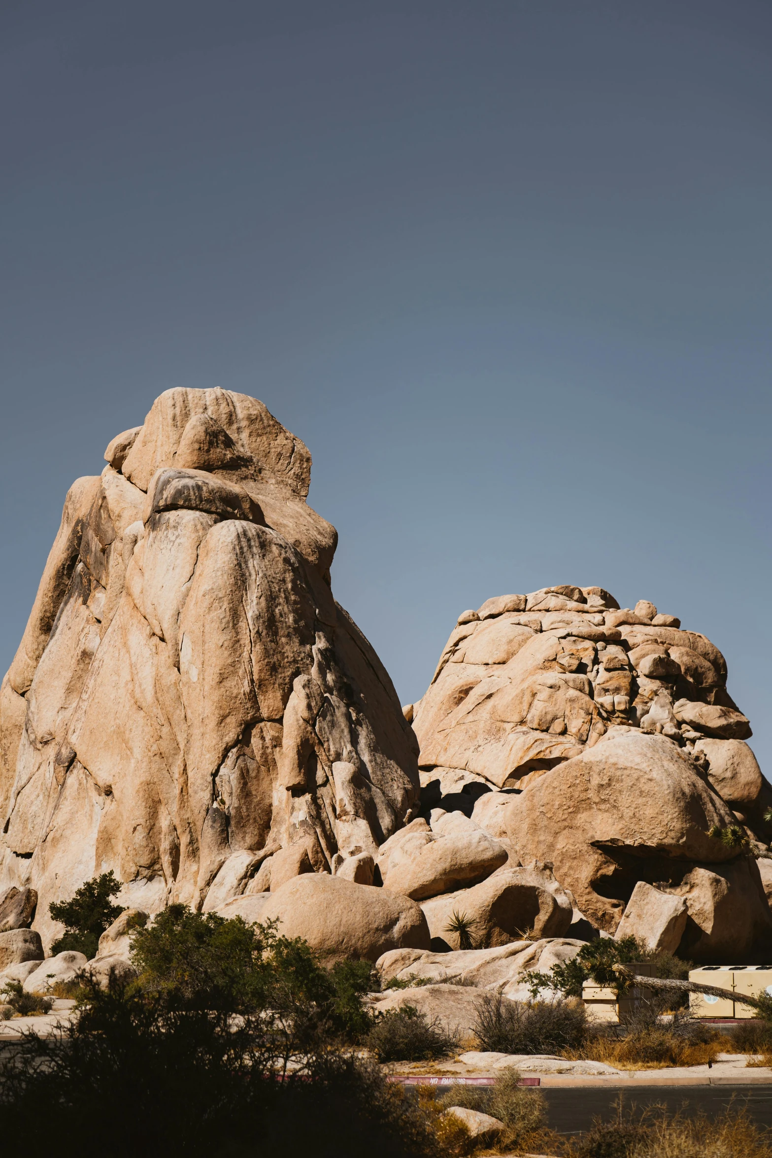 a couple of large rocks sitting next to each other, ultrawide landscape, buttresses, telephoto long distance shot, large noses