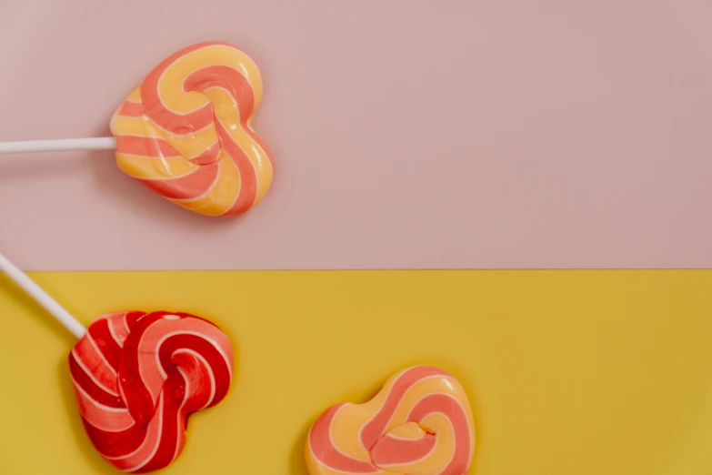 two lollipop lollipop lollipop lollipop lollipop lollipop lollipop lollipop lollipop, inspired by Yanjun Cheng, trending on pexels, pop art, pink and yellow, motion graphic, red hearts, 15081959 21121991 01012000 4k