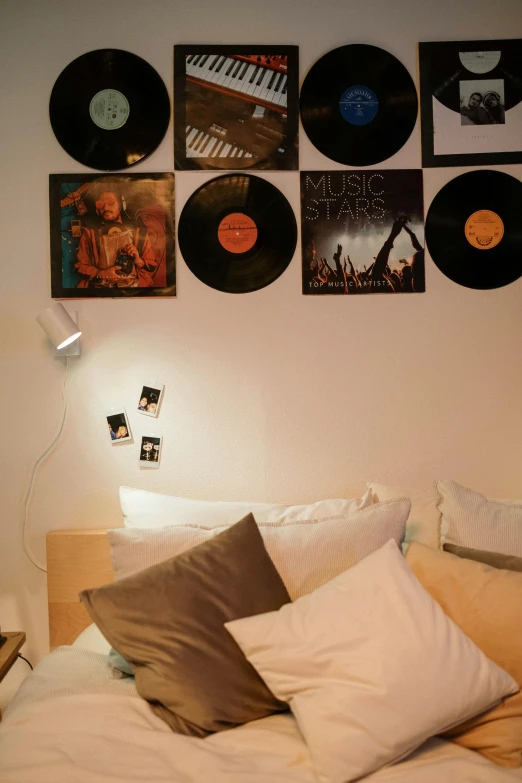 a bed room with a neatly made bed, an album cover, inspired by Albert Paris Gütersloh, pop art, lights, vinyl records, detail shot, movies