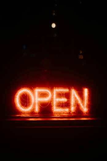 an open sign lit up in the dark, pexels, happening, getty images, unopened, looking straight forward, ron cobb