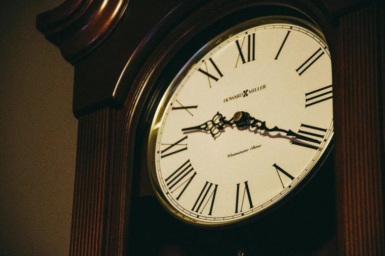 a close up of a clock with roman numerals, by Carey Morris, unsplash, three quarter view, brown, late night, at home