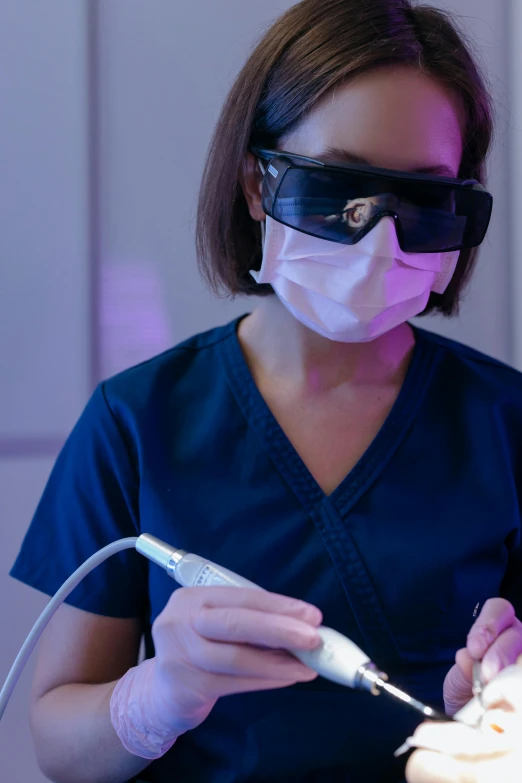 a woman getting her teeth examined by a dentist, a digital rendering, shutterstock, happening, wearing shiny black goggles, ultraviolet light, glowing white lasers, crisp 8 k line work