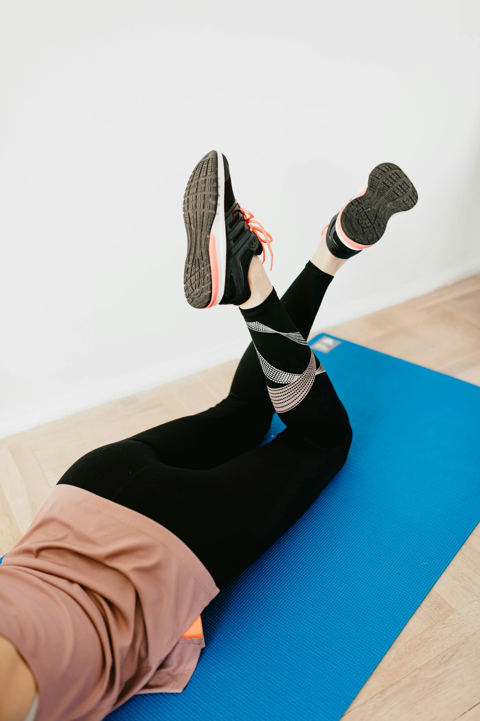 a woman doing an exercise on a yoga mat, by Rachel Reckitt, pexels contest winner, leg and thigh shot, thumbnail, low quality photo, multi-part