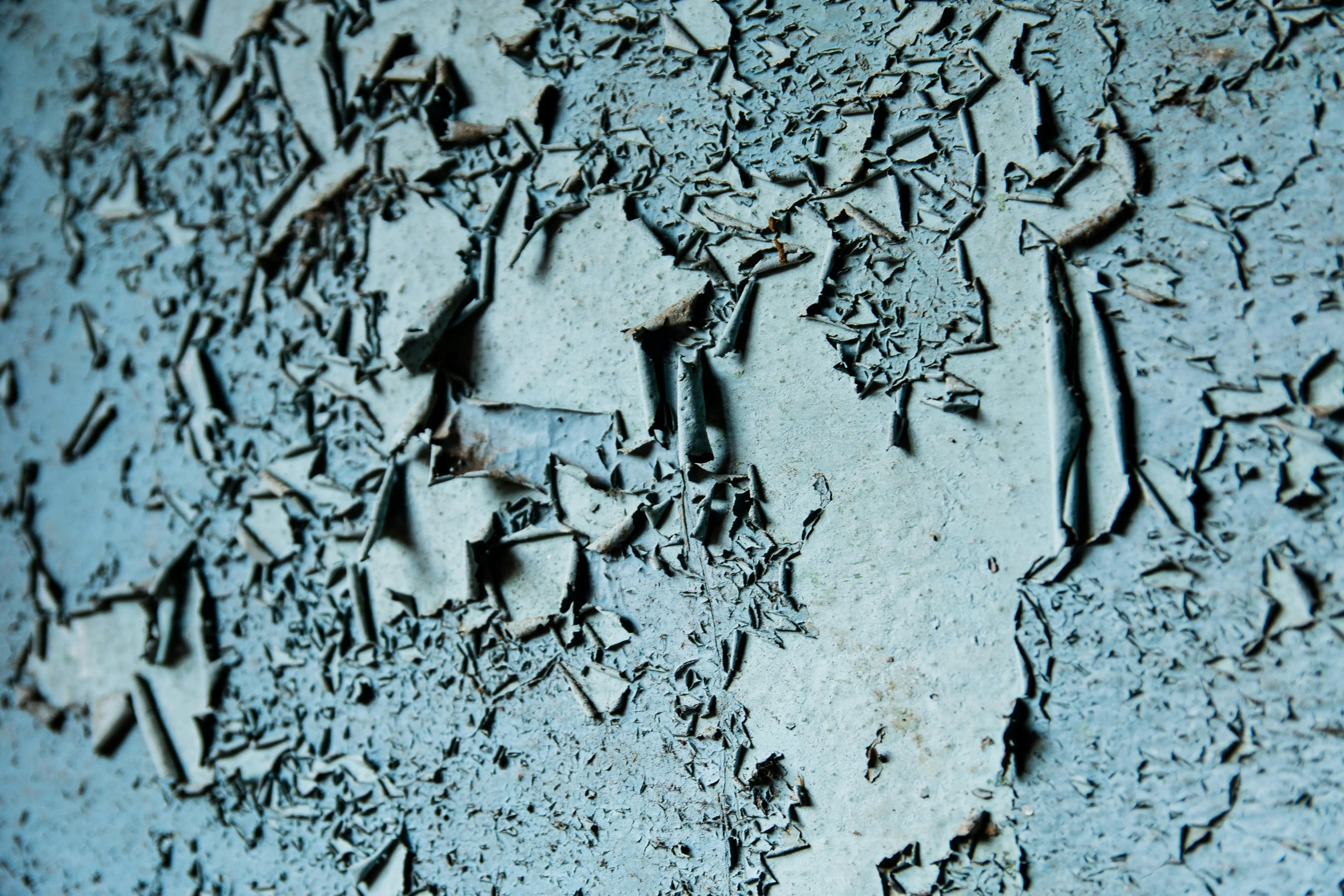 a close up of peeling paint on a wall, an album cover, inspired by Elsa Bleda, pexels, auto-destructive art, blue gray, shards, in 2 0 1 2, dezeen