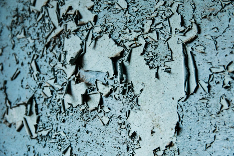 a close up of peeling paint on a wall, an album cover, inspired by Elsa Bleda, pexels, auto-destructive art, blue gray, shards, in 2 0 1 2, dezeen