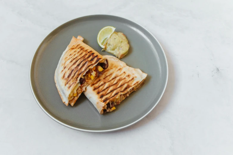 a close up of a plate of food on a table, folded, fan favorite, smokey burnt envelopes, press shot