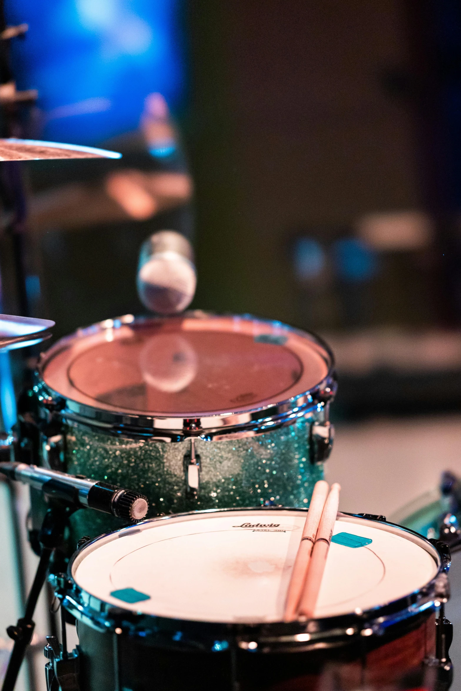 a close up of a drum set on a table, happening, teal, event photography, rectangle, galactic