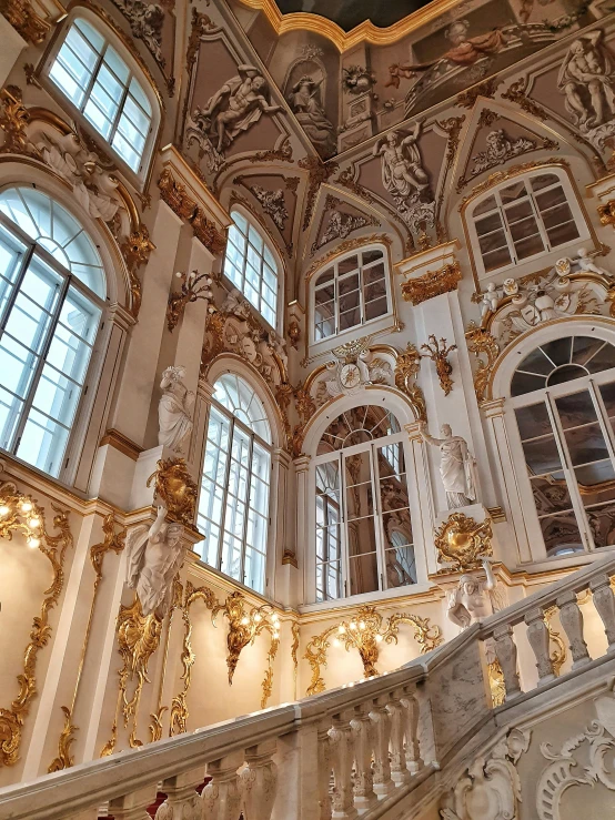 a staircase inside of a building with lots of windows, an album cover, inspired by Vasily Surikov, pexels contest winner, rococo, white with gold accents, saint petersburg, 2 5 6 x 2 5 6 pixels, baroque ornament detail