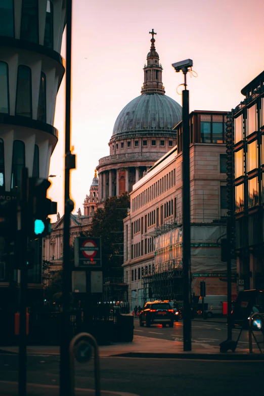 a street filled with lots of traffic next to tall buildings, by Christopher Wren, dome, soft glow, unsplash 4k, profile pic