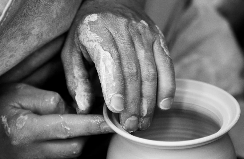 a close up of a person making a pot on a potter's wheel, a black and white photo, by Fuller Potter, jonathan ivy, porcelain organic, portait image, fine art print