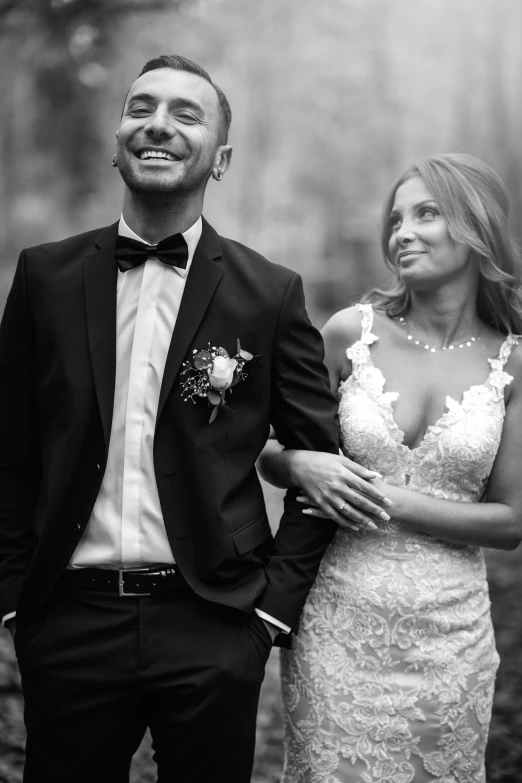 a black and white photo of a bride and groom, by Elena Guro, pexels contest winner, both smiling for the camera, thiago alcantara, suit and waistcoat, edited