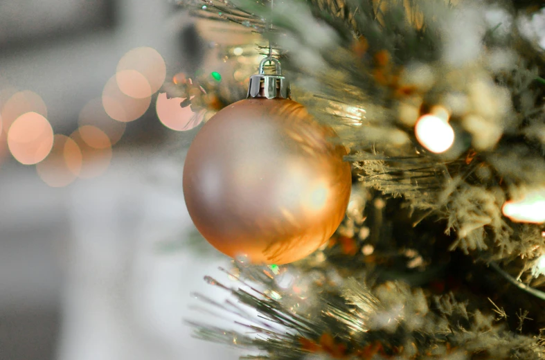 a close up of a christmas ornament on a tree, by David Simpson, pexels, rose gold, grey and gold color palette, modeled, multiple lights