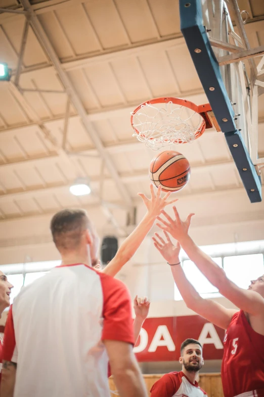 a group of men playing a game of basketball, up close, 15081959 21121991 01012000 4k, focused photo, rectangle