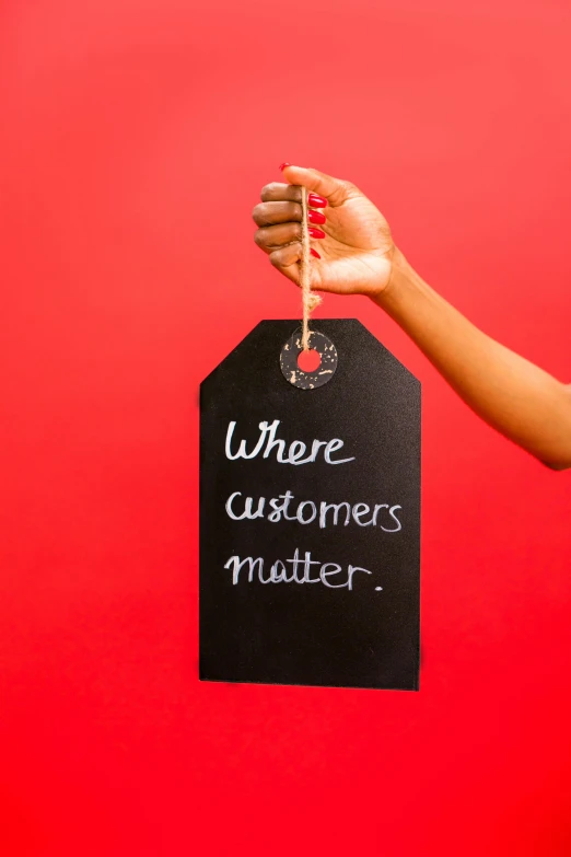 a woman holding a wine glass with the words where customers matter, an album cover, by Matthias Stom, shutterstock contest winner, dressed in red paper bags, 15081959 21121991 01012000 4k, aida muluneh, had