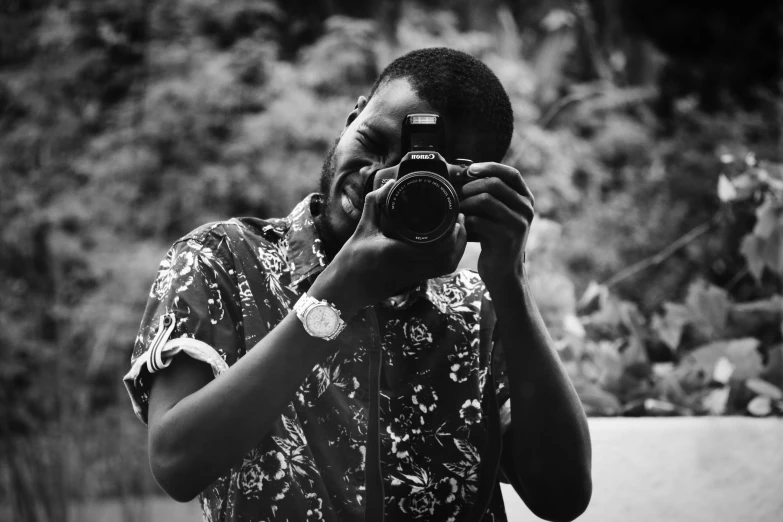 a man taking a picture with a camera, a black and white photo, by Chinwe Chukwuogo-Roy, detailed medium format photo, cute photo, profesional photo, flash photo