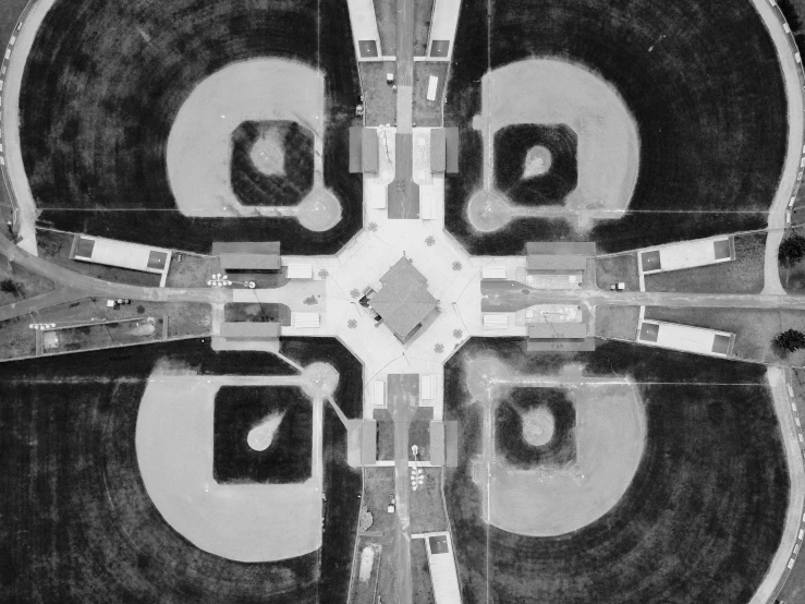a black and white photo of an aerial view of a baseball field, by Russell Patterson, conceptual art, symmetrical mechanical features, square, gas station in space, architectural plan