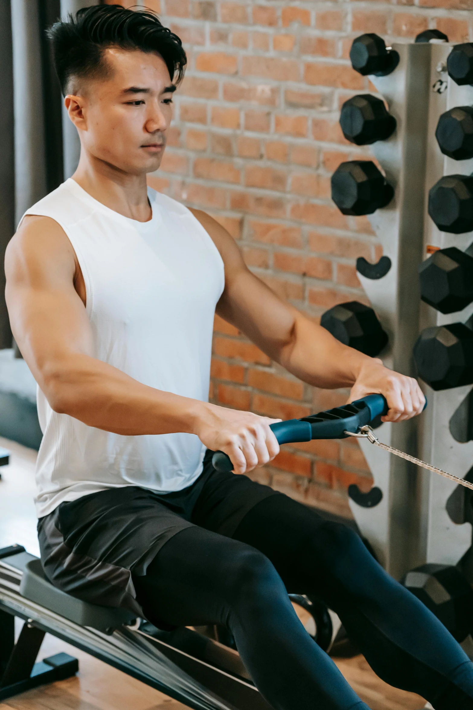 a man using a rowing machine in a gym, pexels contest winner, renaissance, tithi luadthong, profile image, thumbnail, arched back