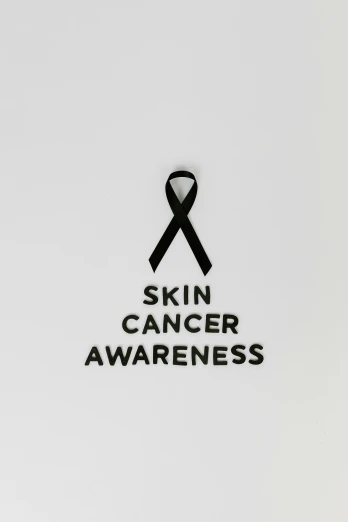 a black ribbon with the words skin cancer awareness on it, a picture, by Gavin Hamilton, skincare, in kaethe butcher, 4