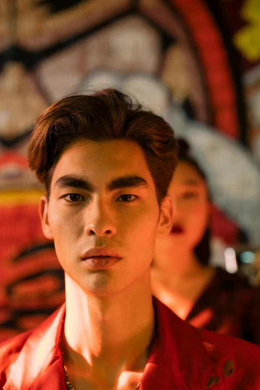 a group of young men standing next to each other, a picture, inspired by Zhang Han, trending on pexels, photorealism, his eyes glowing red, portrait of modern darna, male model, large eyebrows