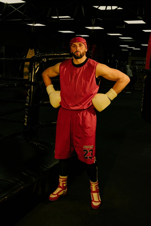 a man posing for a picture in a gym, inspired by Volkan Baga, sam hyde in gold suit, red gloves, kyle hotz, authentic costume