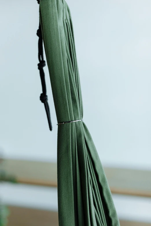 a green umbrella sitting on top of a wooden table, intricate hakama, ultrafine detail, detailed product image, reeds