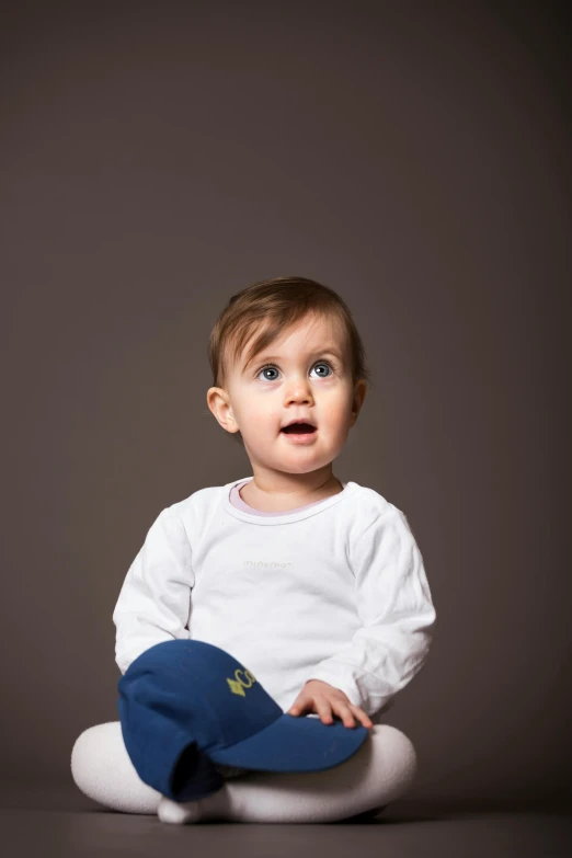 a baby in a white shirt and blue pants, shutterstock contest winner, studio!! portrait lighting, curious, luca, ilustration