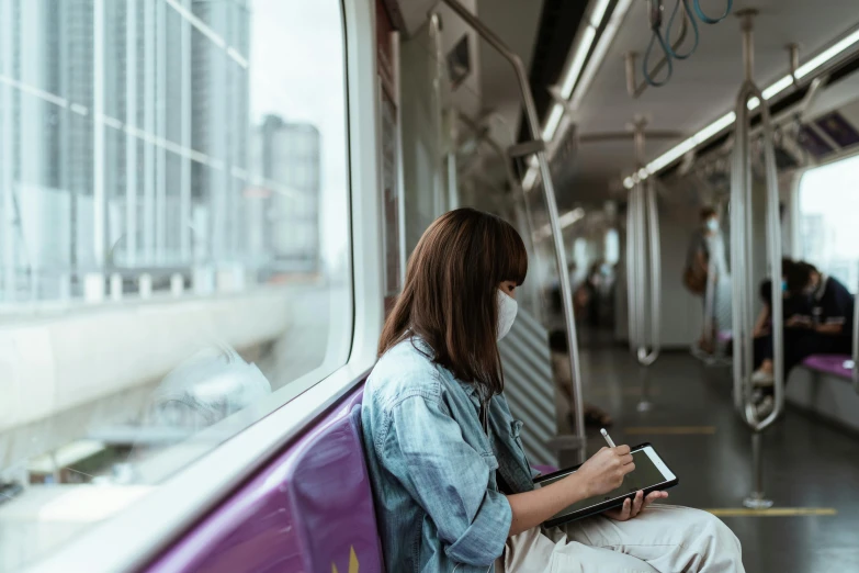 a woman sitting on a train reading a book, pexels contest winner, graffiti, avatar image, worksafe. instagram photo, asian women, thumbnail