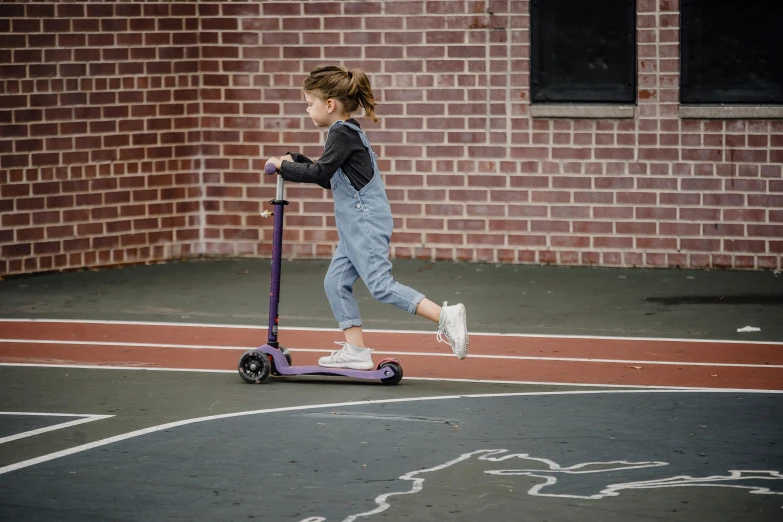 a little girl riding a scooter on a basketball court, inspired by Violet Fuller, dribble, reflective scales, alana fletcher, origin jumpworks, taken with canon 5d mk4