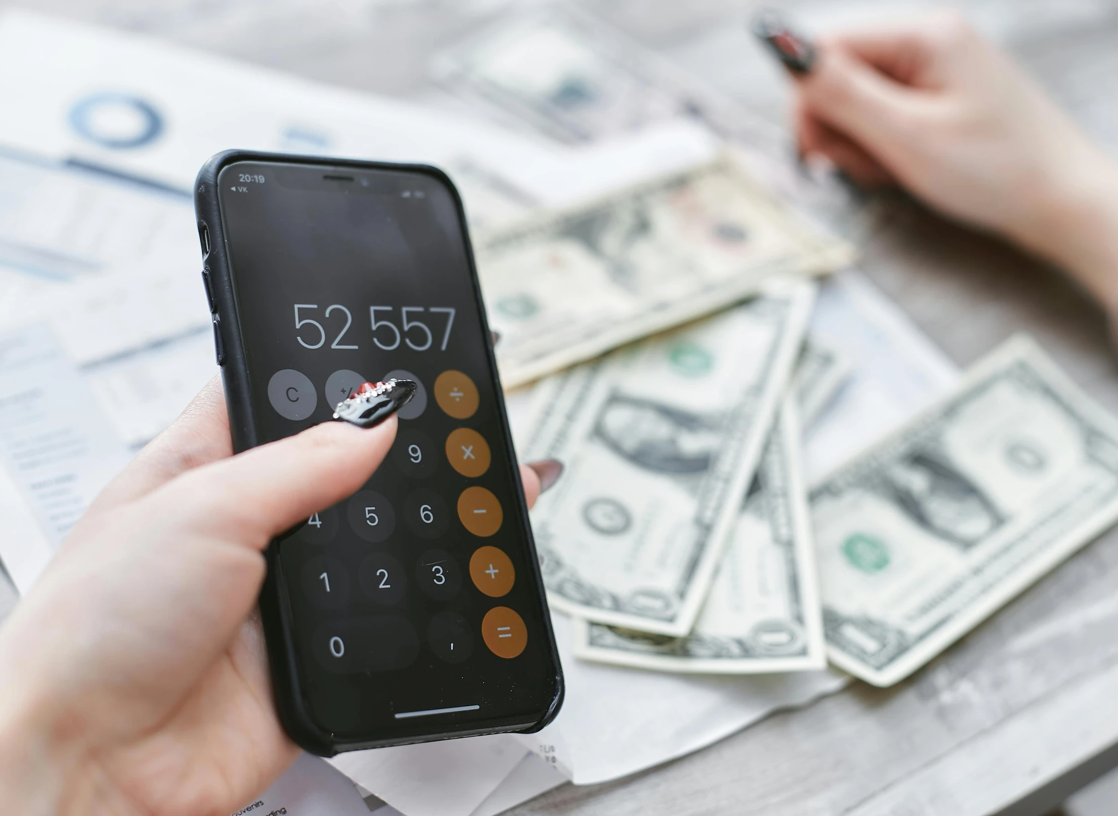 a person using a calculator next to a pile of money, a photo, pexels contest winner, hurufiyya, 🚀🌈🤩, instagram post, flat, 1 2 9 7