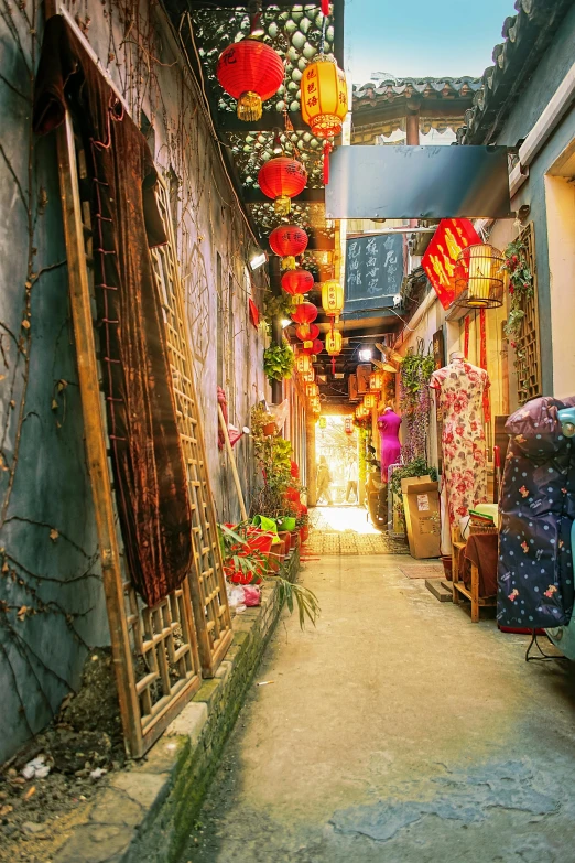 a narrow alley with lanterns hanging from the ceiling, inspired by Liu Jue, cloisonnism, photograph of enchanted garden, fishing village, like jiufen, chinese costume