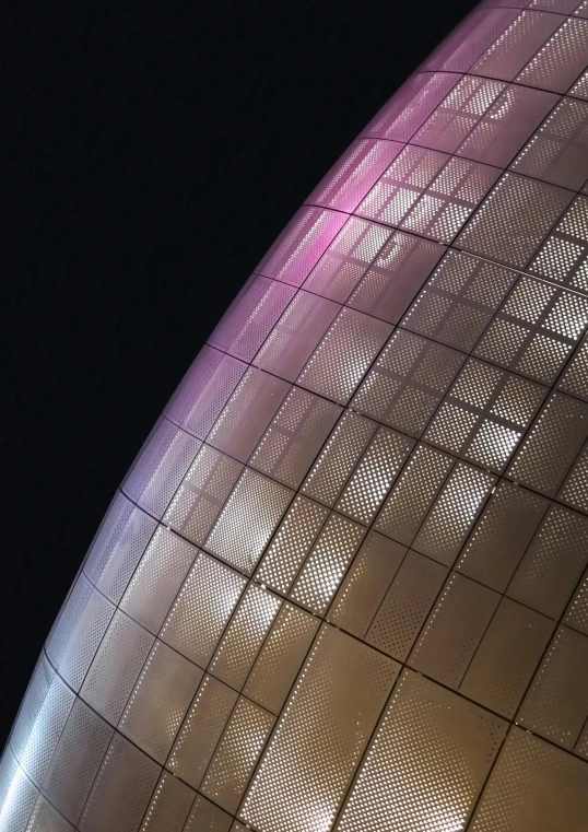a close up of a building lit up at night, by Doug Ohlson, dyson sphere program pink planet, metal panels, taken on a 2010s camera, shot for imax