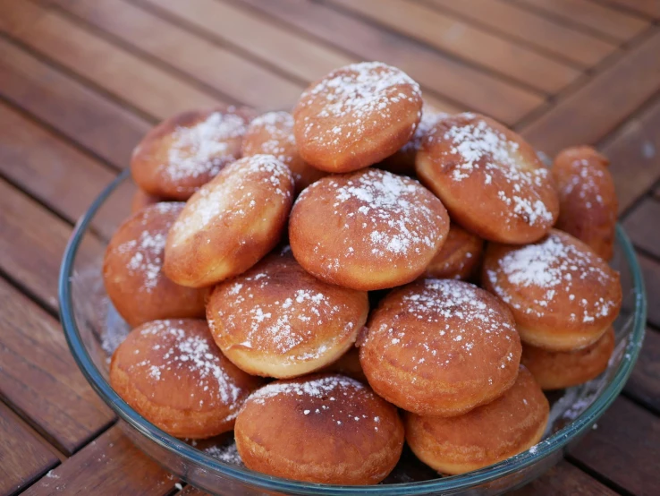 a glass bowl filled with donuts covered in powdered sugar, inspired by Ödön Márffy, pixabay, hurufiyya, pancakes, burger, taken in the late 2010s, portrait photo