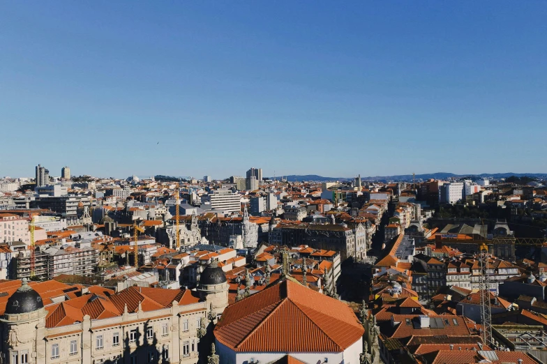 a view of a city from the top of a building, pexels contest winner, baroque, clear blue skies, gui guimaraes, youtube thumbnail, square