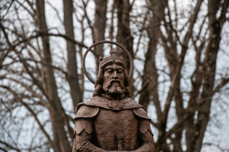 a statue of a man with a crown on his head, a statue, by Attila Meszlenyi, unsplash, sqare-jawed in medieval clothing, god of the forest, made of wrought iron, orthodox saint