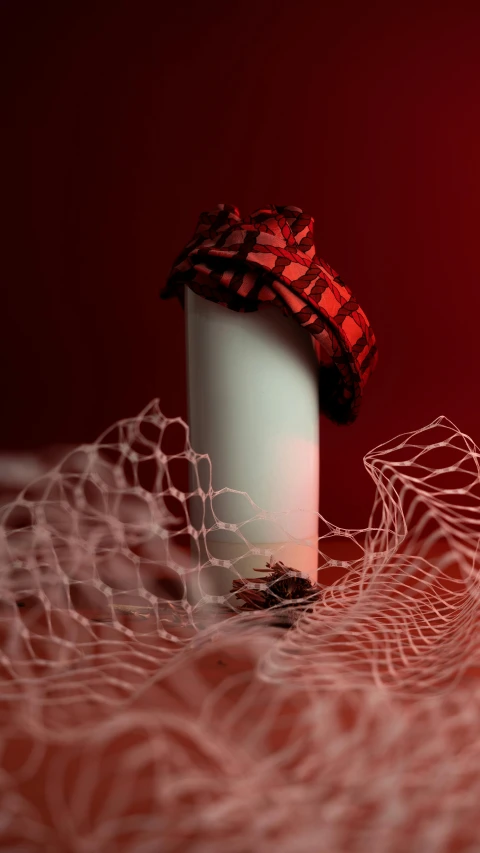 a candle sitting on top of a table next to a net, an album cover, inspired by Chiharu Shiota, shutterstock contest winner, red hat, showstudio, 15081959 21121991 01012000 4k, holiday season