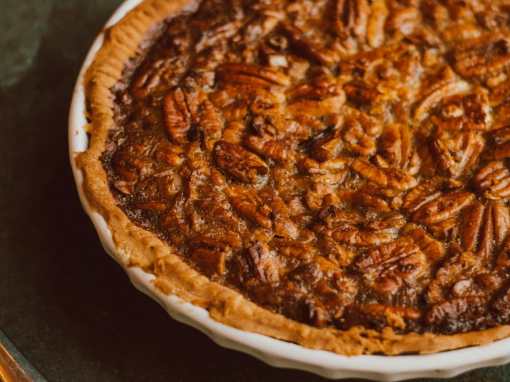 a close up of a pie on a table, pexels contest winner, nut, 🦩🪐🐞👩🏻🦳, baked beans, centered close-up