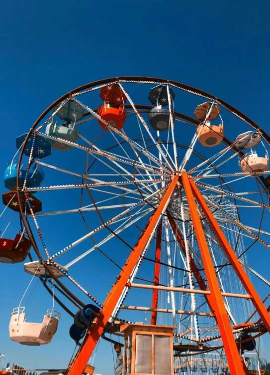 a ferris wheel in front of a blue sky, slide show, square, orange, 15081959 21121991 01012000 4k