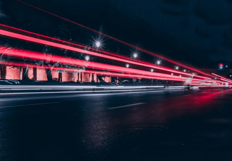 a long exposure photo of a city street at night, by Adam Marczyński, pexels contest winner, futurism, red car, laser beam ; outdoor, transparent background, multiple stories