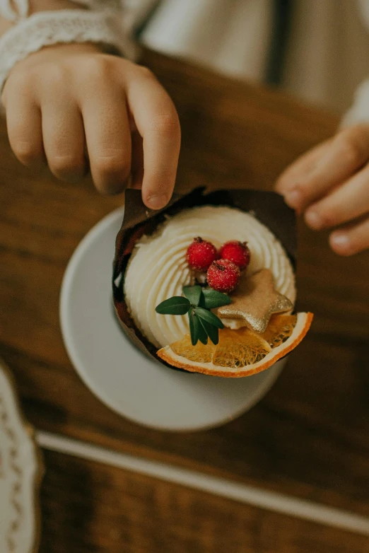 a close up of a person holding a plate of food, cake in hand, melbourne, botanicals, smol