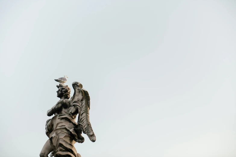 a statue of an angel on top of a building, a statue, by Matthias Weischer, pexels contest winner, neoclassicism, wearing winged helmet, a messy, fine art print, portait image