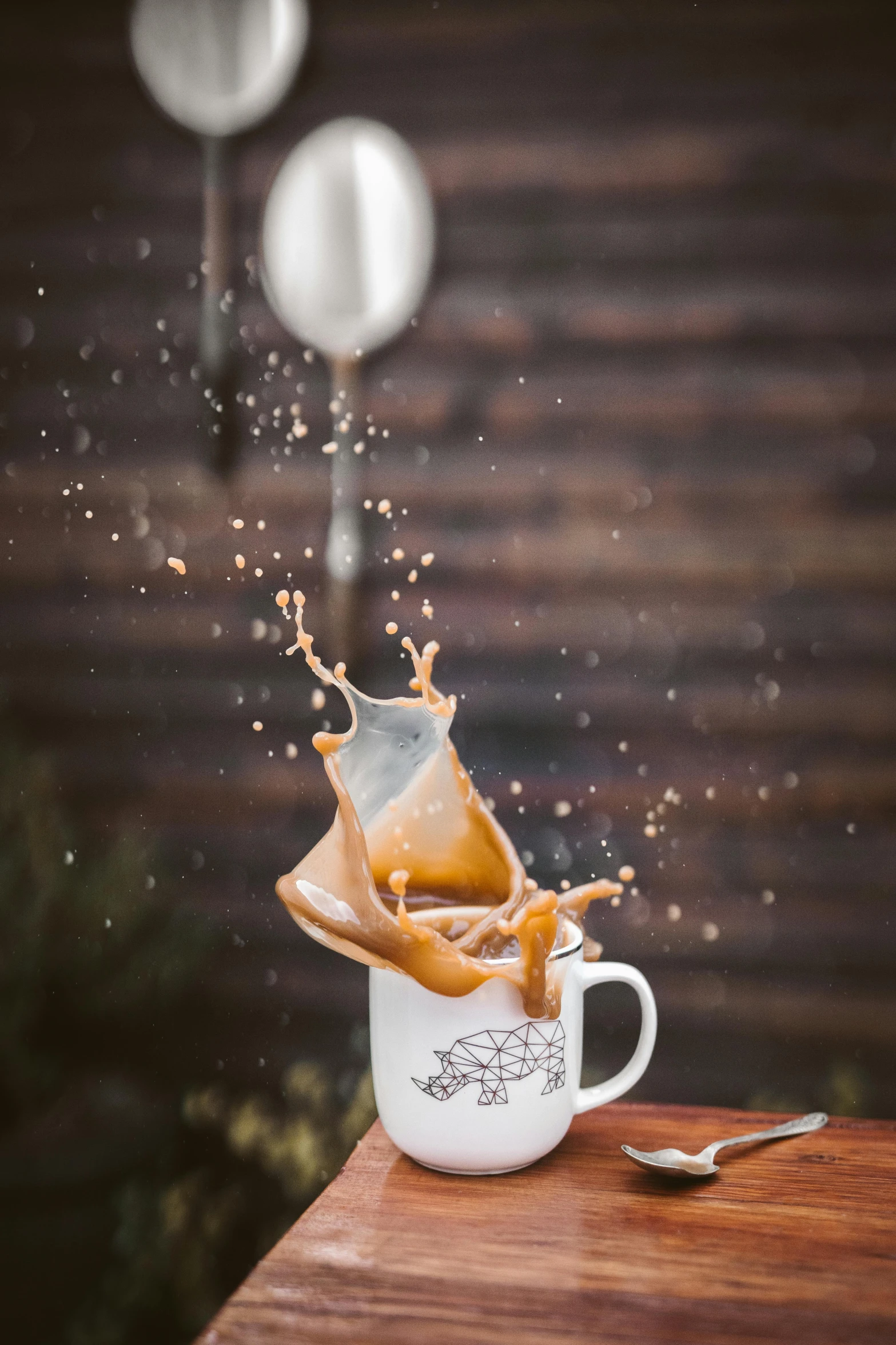 a coffee cup with liquid pouring out of it, pexels contest winner, flying mud, caramel, botanicals, exterior shot