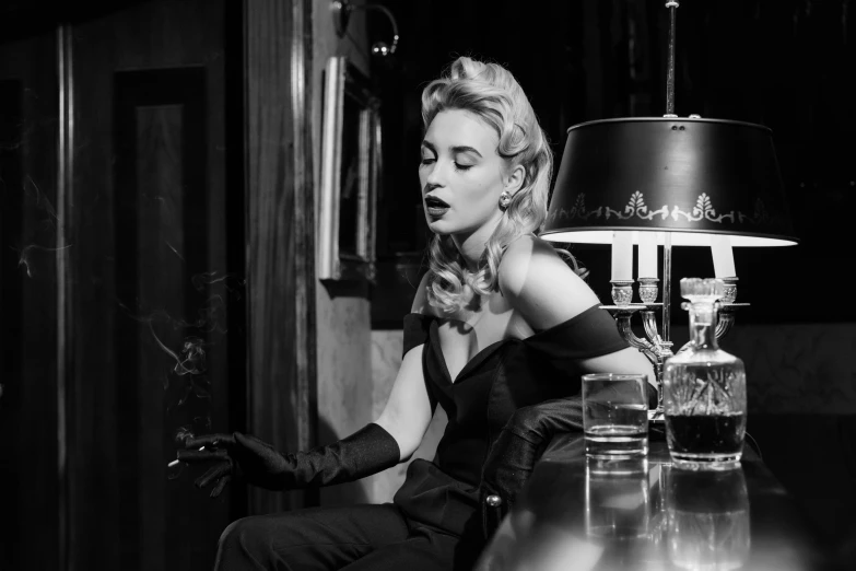 a black and white photo of a woman smoking a cigarette, inspired by George Hurrell, pexels, rockabilly style, in a dark dusty parlor, emma roberts, haute couture fashion shoot